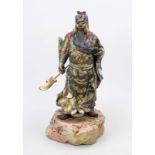 Warrior on rock, China, 20th century, wood polychrome and gold painted. Slightly rubbed & bumped, h.