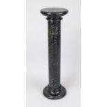 Flower column, 20th century, black polished stone with natural pattern, smooth shaft over profiled