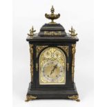 Large table clock, ebonized wood, decorated with gilt bronze, floral motifs and female heads,