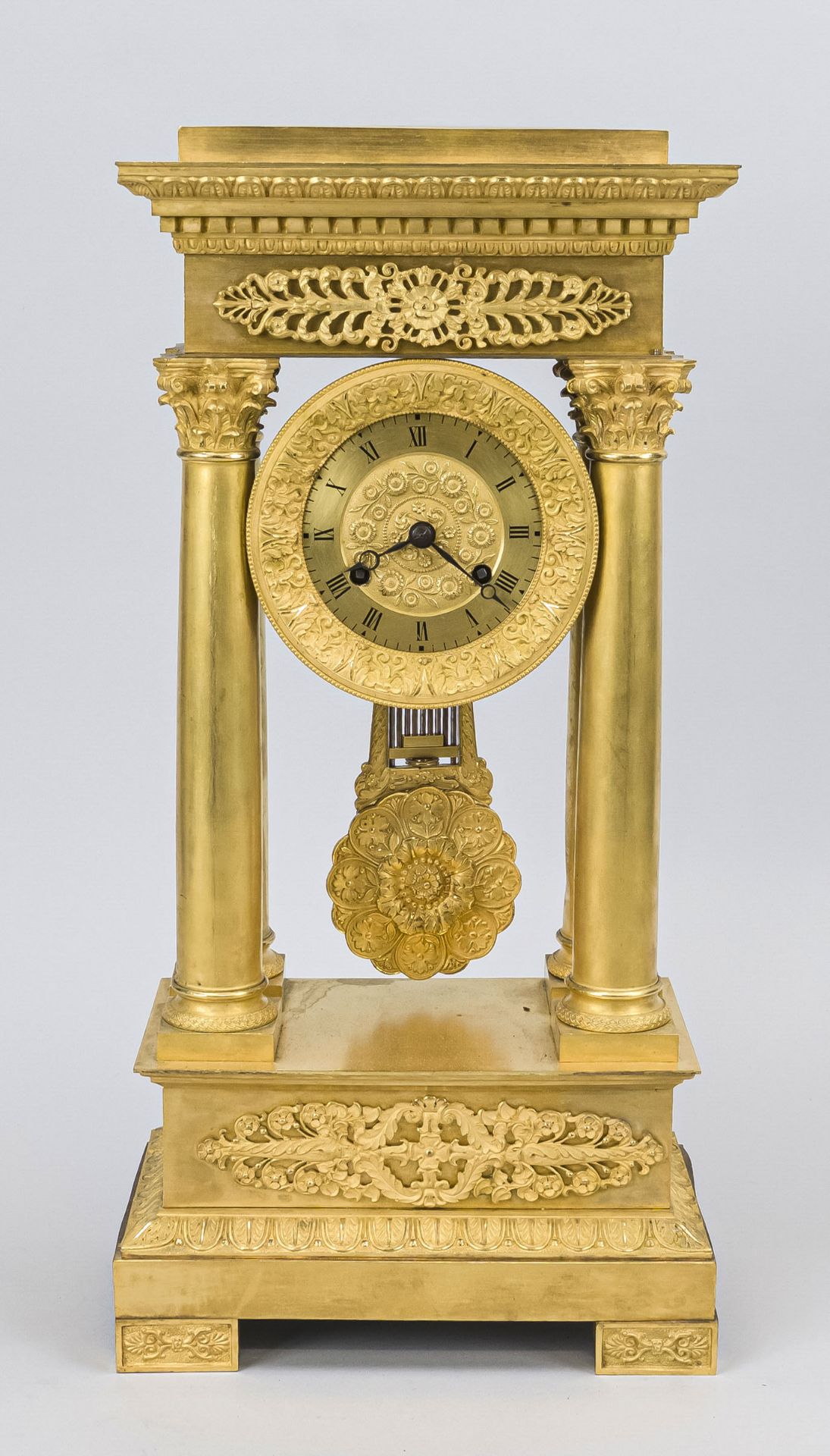 Empire portal clock, fire-gilt bronze, 2nd half 19th century, the base with floral tendril motifs,