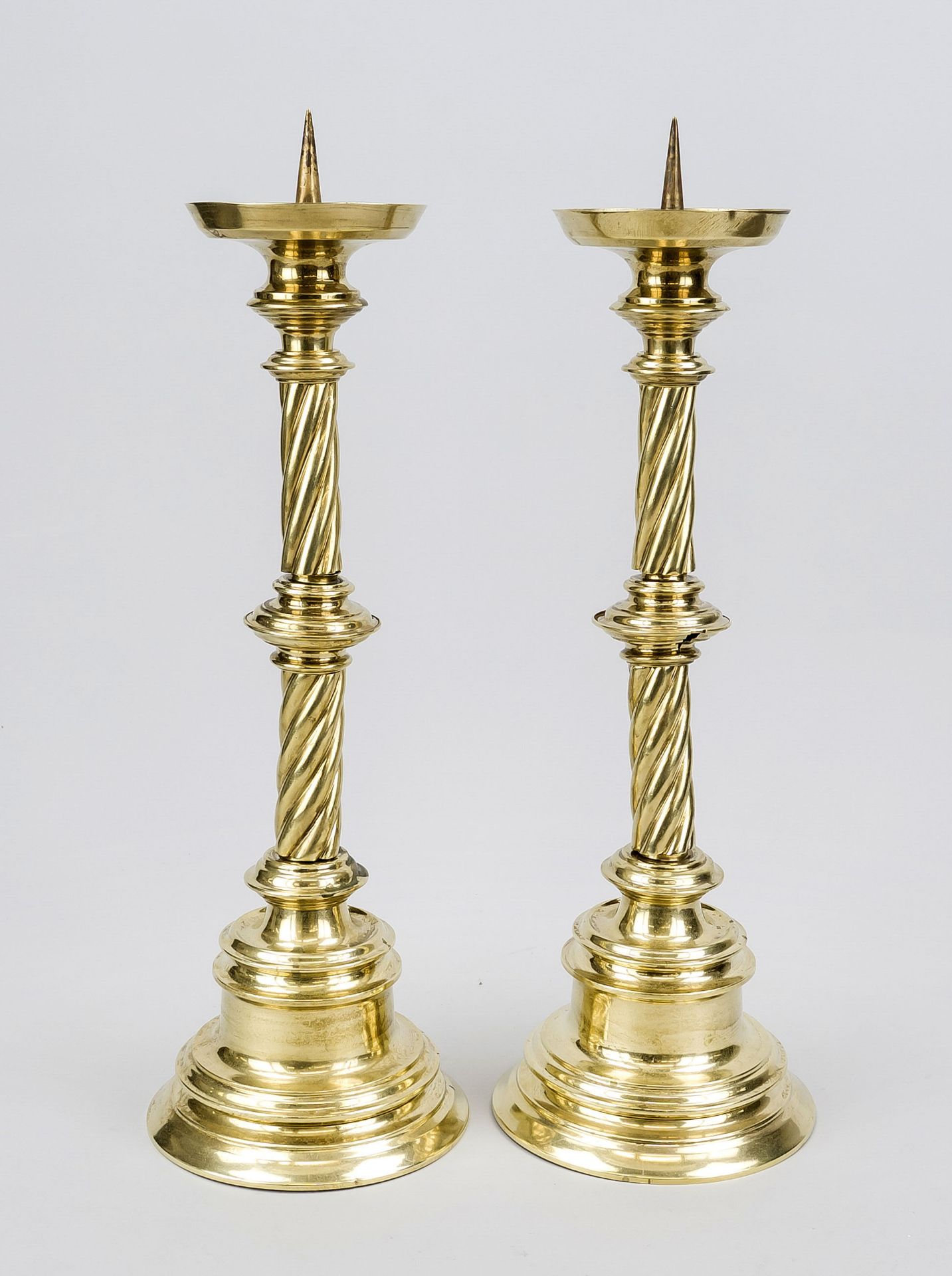 Pair of altar candlesticks, late 19th century, sheet brass. Twisted shaft with nodus on a profiled