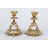 Pair of candlesticks, 19th century, gilded bronze on onyx plate, h. 13 cm