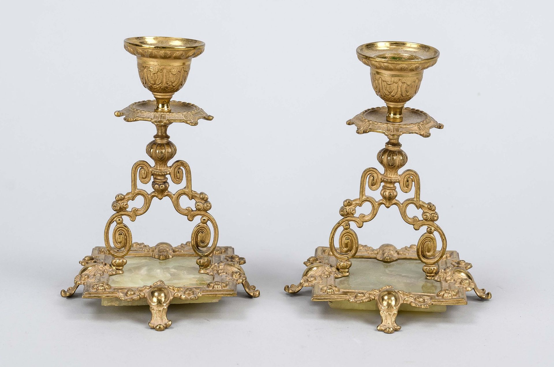 Pair of candlesticks, 19th century, gilded bronze on onyx plate, h. 13 cm