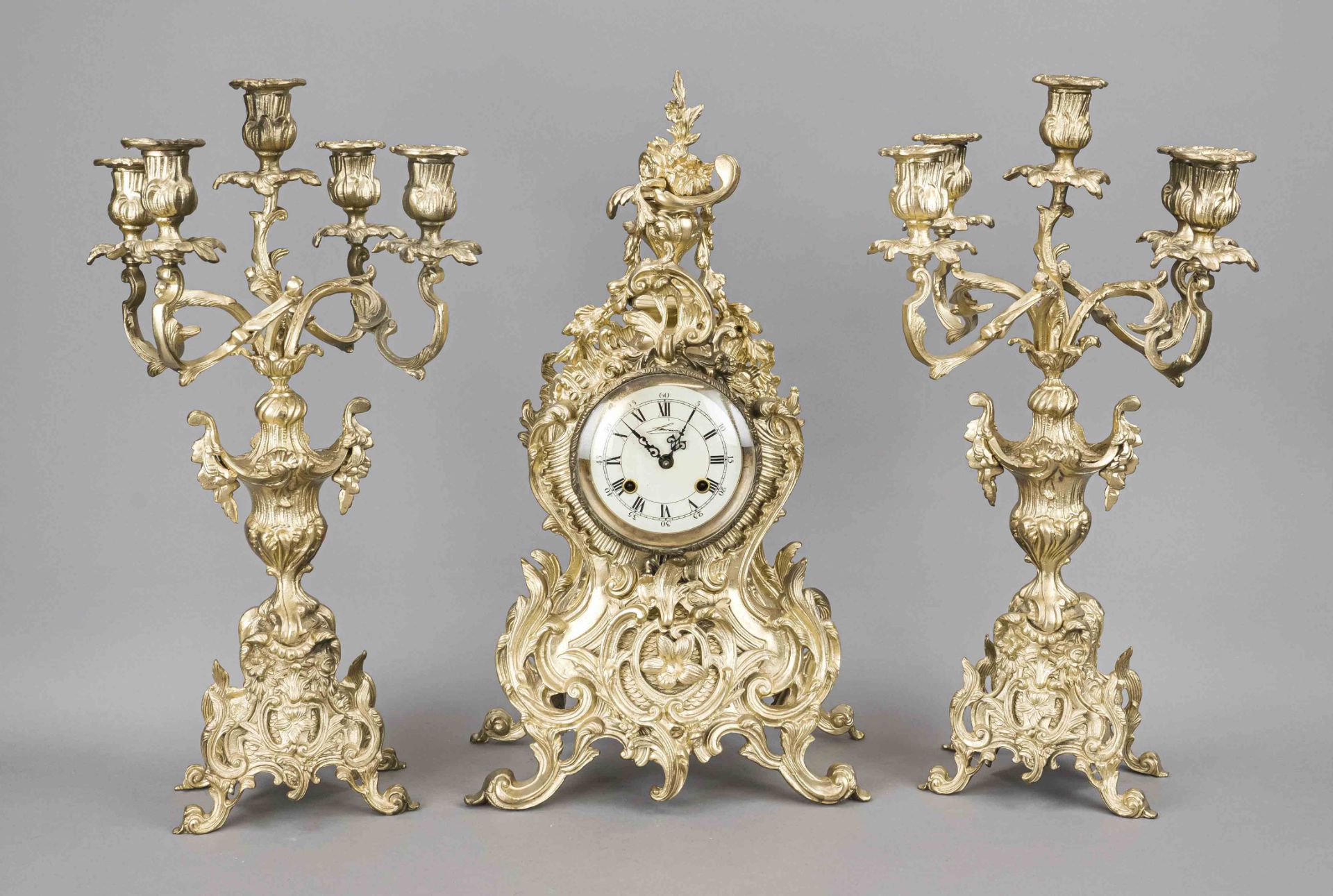 Pendulum with 2 candlesticks, 2nd half 20th century, color gilded, richly decorated with rocailles