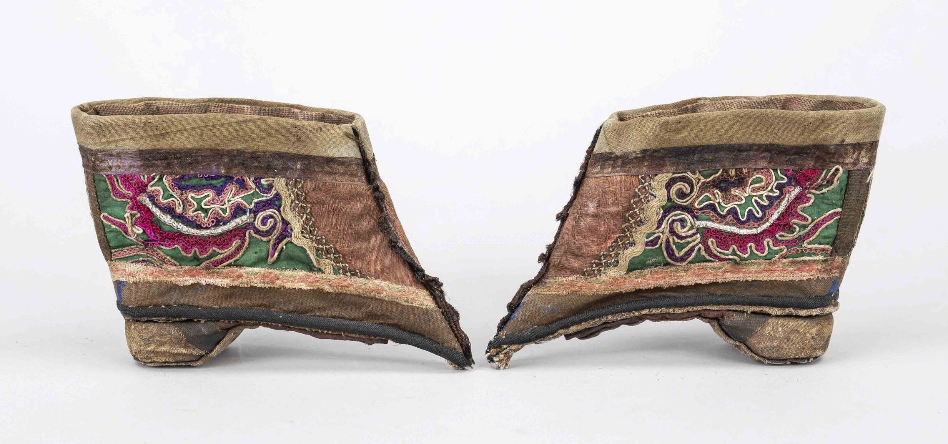 Lotus shoes, China, Qing dynasty (1644-1912), 19th century, polychrome textile on wooden background,