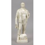 Sculptor mid 20th century, white glazed ceramic of a standing miner, unmarked, h. 35 cm