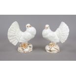 Pair of peacock doves on a rock base, Italy, 20th century, ceramic, white and lightly painted,