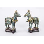 A pair of cloisonné censers/covered vessels, China 19th century (Qing). Standing donkeys with saddle