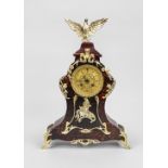 Table clock with red wood, the front covered with tortoiseshell and decorated with floral gilt