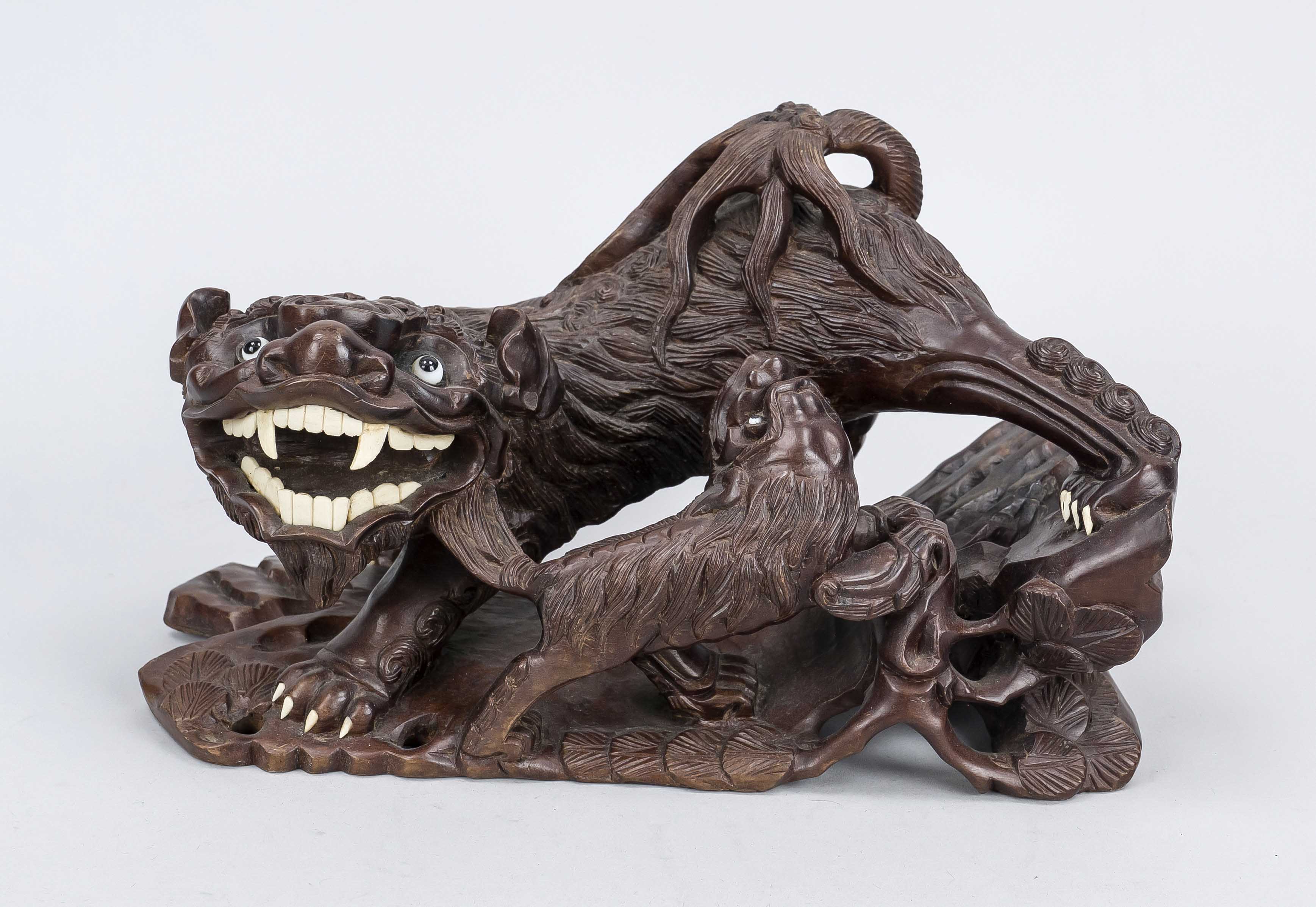 Figural hardwood carving, China 20th century Dark, finely grained hardwood with bone inlays and