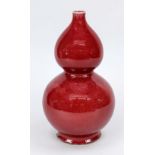 Monochrome double gourd vase, China 19th century (Qing). Balustrated body with oxblood-colored