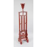 Large candlestick, China, c. 1900, wood with red lacquer. Openwork stand with carved tendrils.