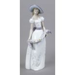 Flower girl, Lladro, Spain, 20th century, model no. 6866, standing lady in a long dress and hat,