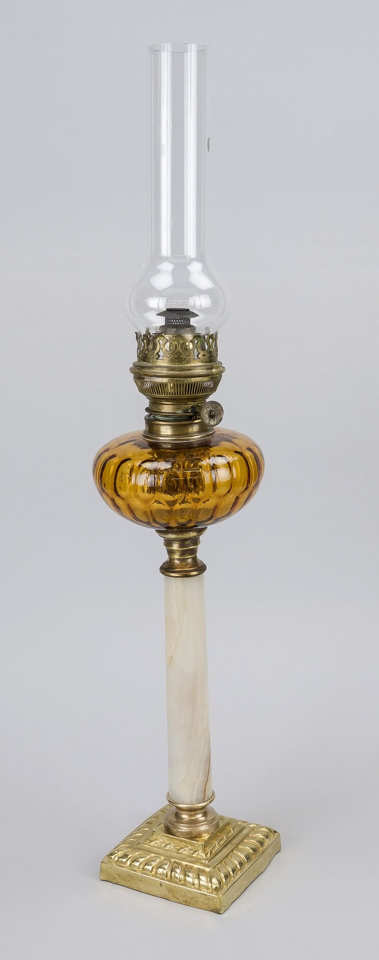 Petroleum lamp, late 19th century. Marble column shaft on an ornamented base. Tank of brown glass,