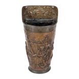 Umbrella stand, Dutch, late 19th century, sheet copper with embossed decoration of a bourgeois