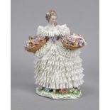 Flower girl, Sitzendorf, Thuringia, 20th century, girl in elaborate rococo dress, standing on a