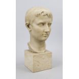 Bust of Julius Caesar, heavy cast stone of the 20th century, on cream-colored marble base, unmarked,