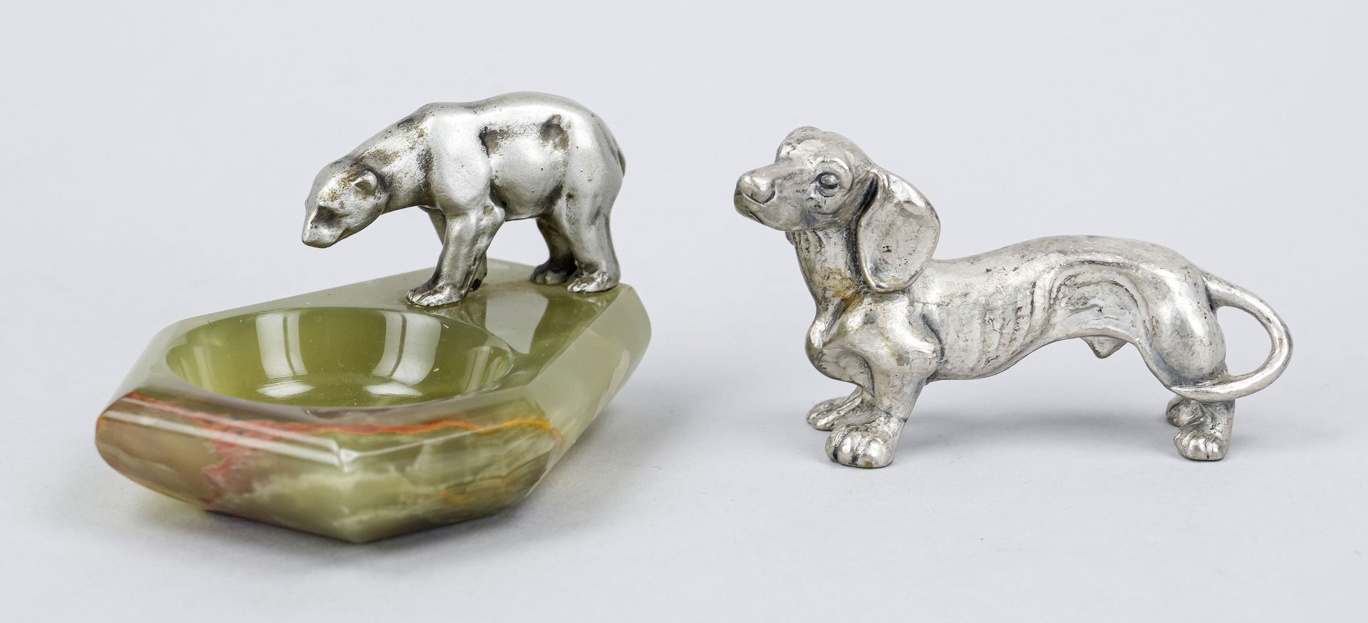 Two small bronzes, mid-20th century, dachshund and polar bear on a small onyx marble bowl, each