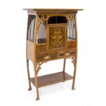 Art Nouveau ornamental cabinet, England, c. 1900, mahogany with floral inlays, curved frame with