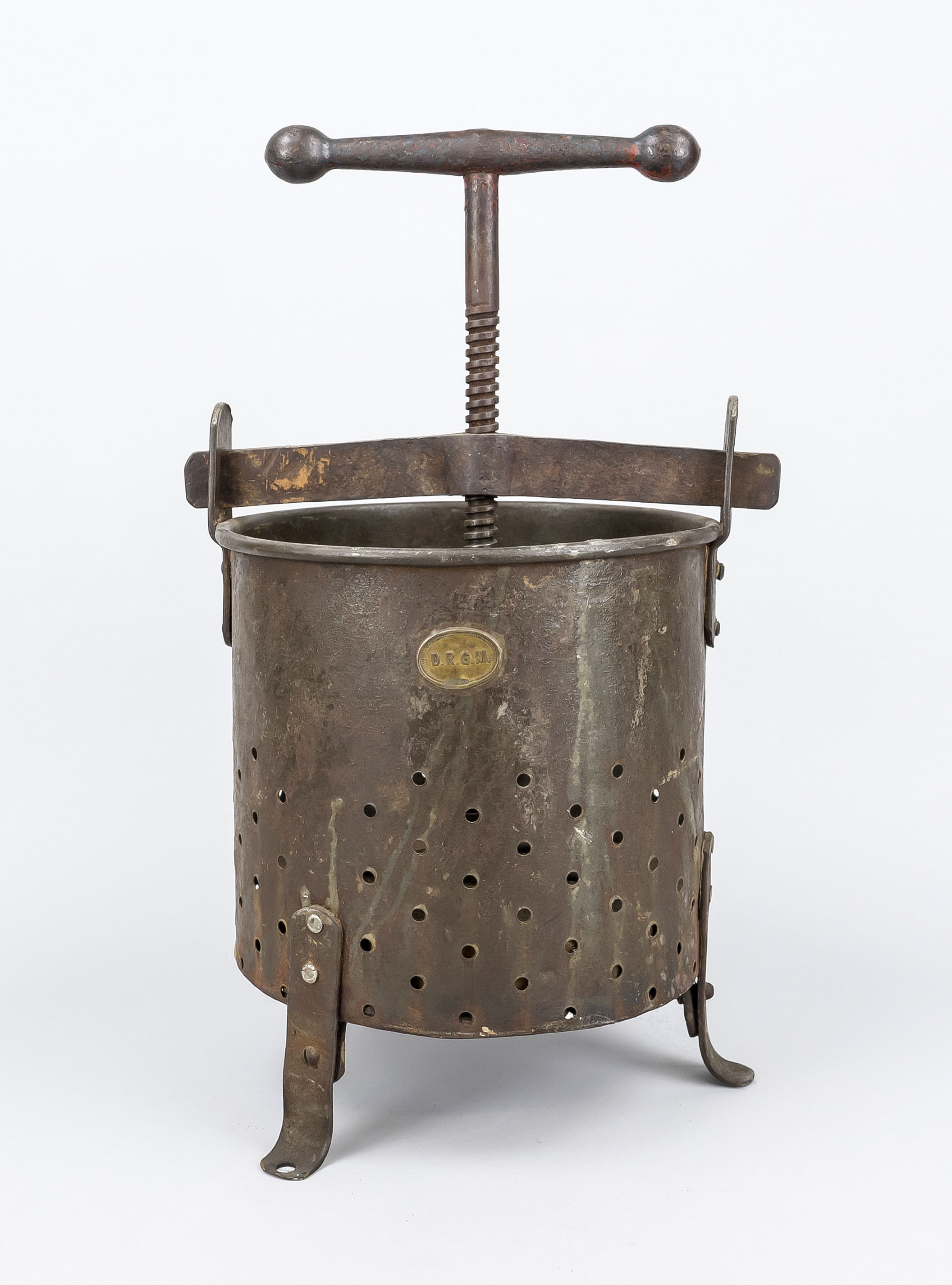 Historic juice press/cider press, 19th century, iron. Perforated cylinder on 3 feet with large