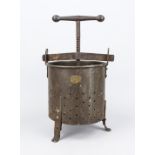 Historic juice press/cider press, 19th century, iron. Perforated cylinder on 3 feet with large