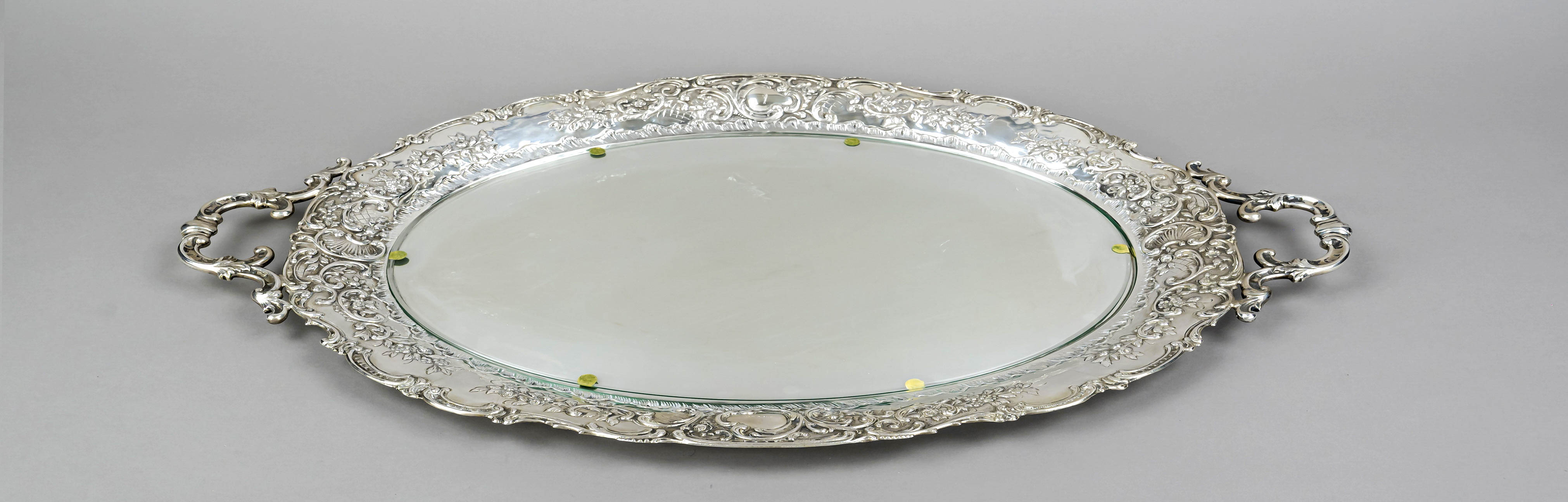 A large oval tray, German, 20th century, maker's mark OS, silver 800/000, curved rim with applied