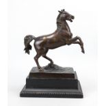 Anonymous sculptor c. 1900, sculpture of a rising horse, brown patinated cast metal on black painted