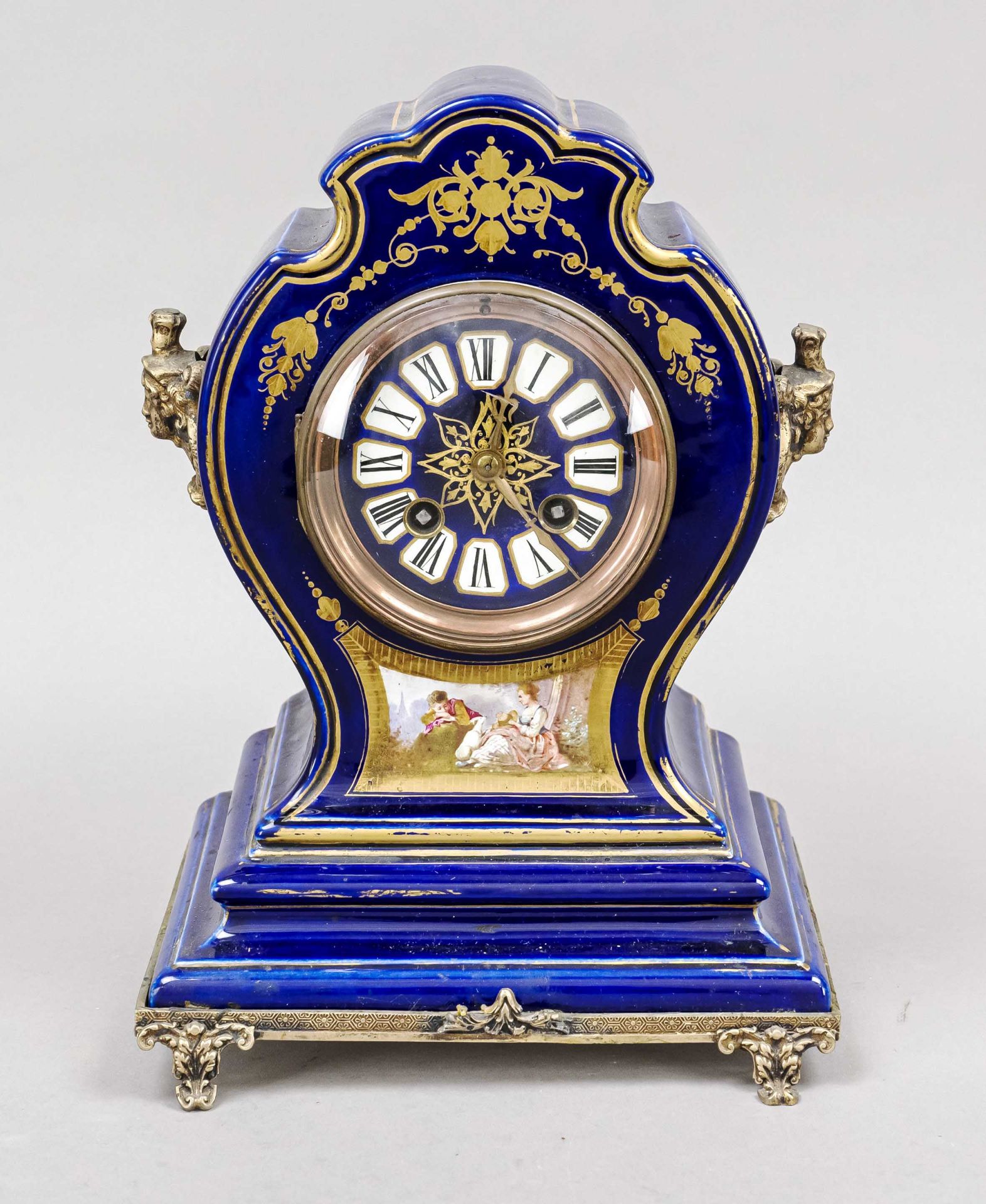 Porcelain 20th century table clock, marked ''Longwy'', blue with decorative gilding and romantic