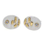 Design cufflinks silver 925/000 and gold, with 2 round faceted blue gemstones 3.2 mm, l. 24 mm, 19.2