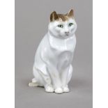 Sitting cat, Rosenthal, Selb, mark 1921-38, painted in underglaze colors, chipped, h. 8.5 cm