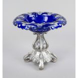 Centerpiece, late 19th century, filled stand, probably under-alloyed silver, square form on 4 volute