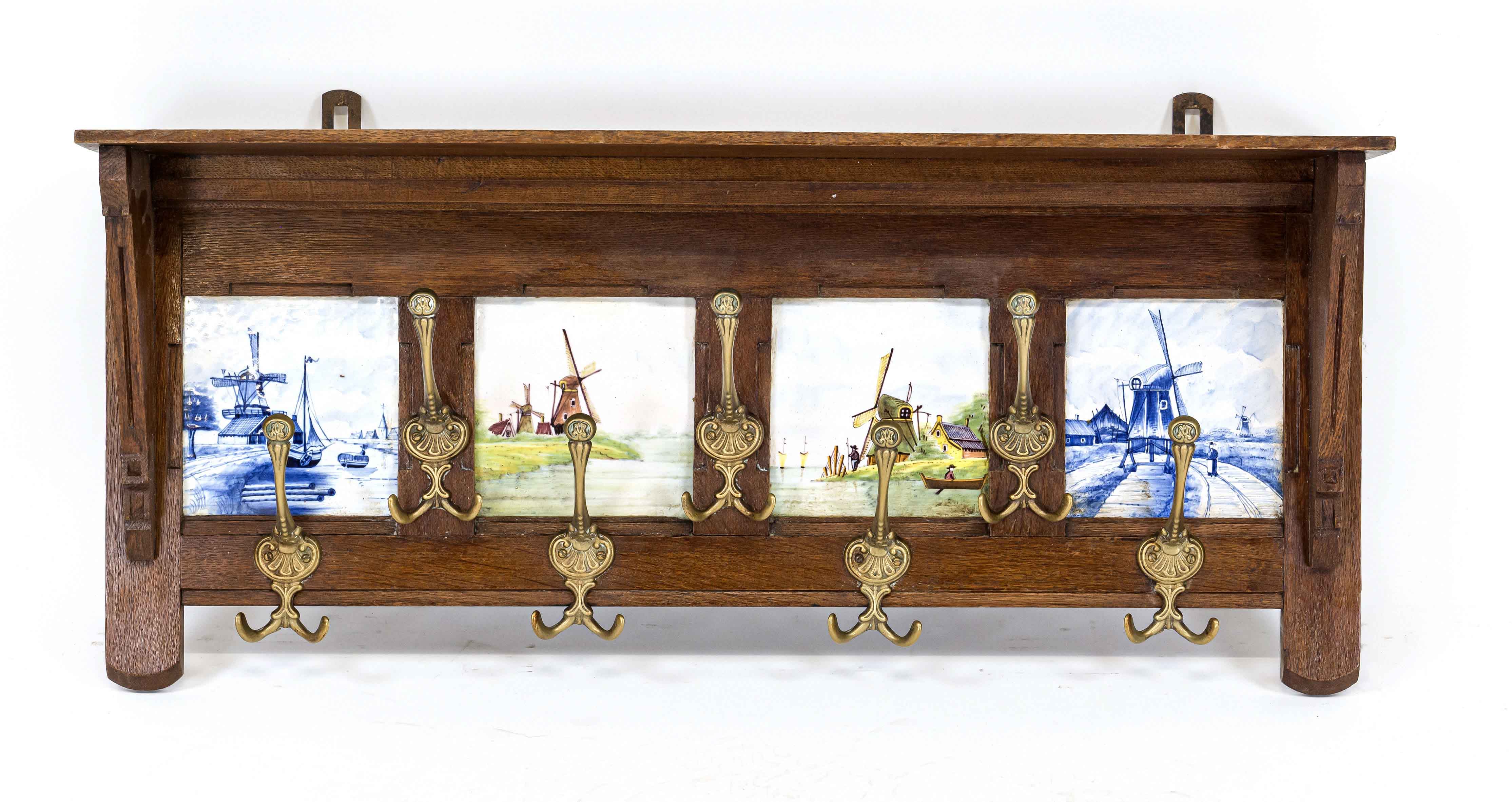 Wall coat rack around 1900, oak, four blue and polychrome tiles with windmills, 7 brass hooks, 38