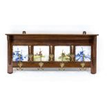 Wall coat rack around 1900, oak, four blue and polychrome tiles with windmills, 7 brass hooks, 38