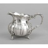 Cream jug, German, 20th century, silver 800/000, gilded interior, on 4 decorated feet, bulbous body,