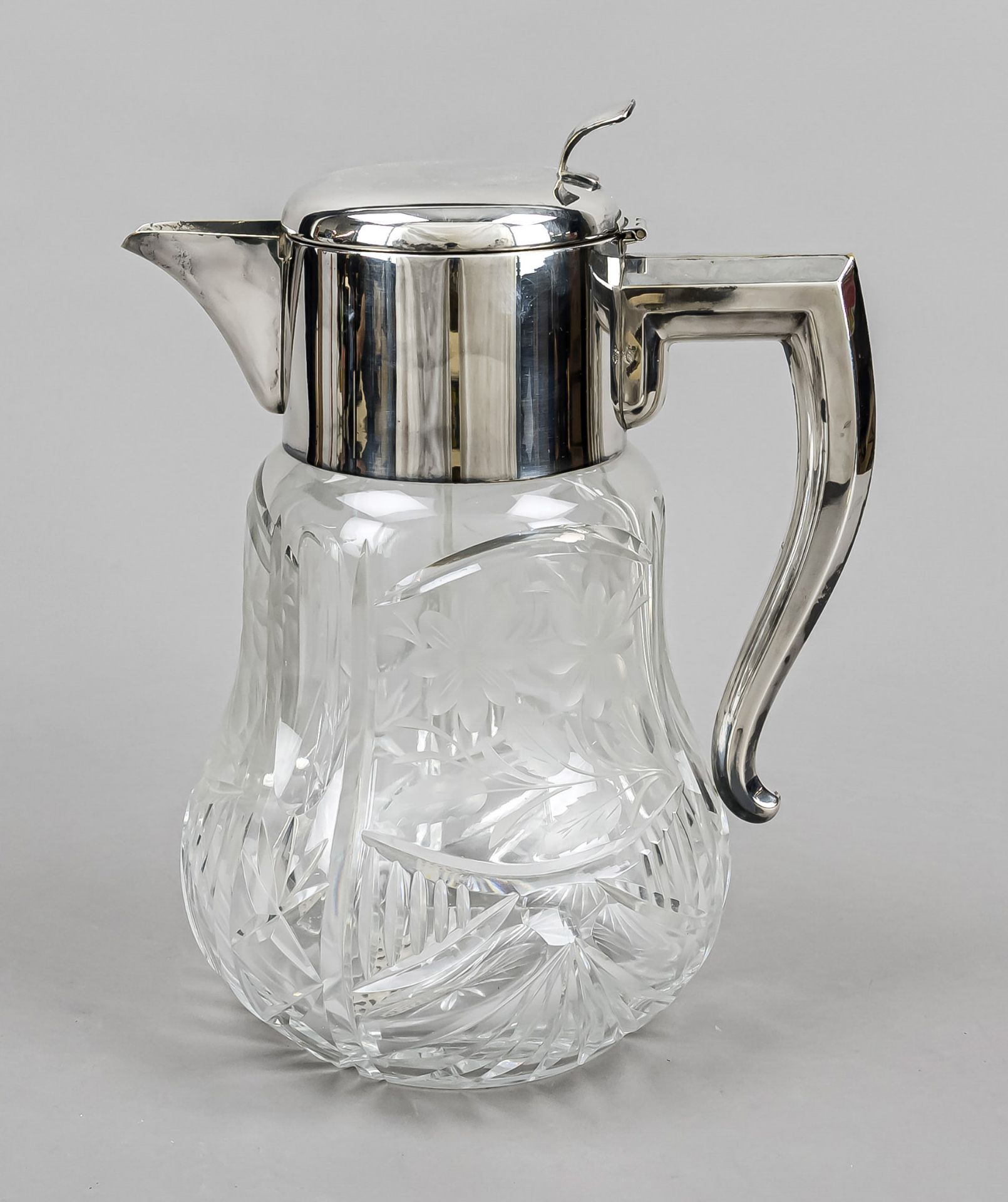Large juice jug, 20th century, mounting plated, clear glass body, with rich cut decoration, strainer
