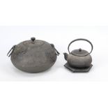 Teapot on stand and large lidded box, Japan 19th/20th century, iron. Relief decoration with