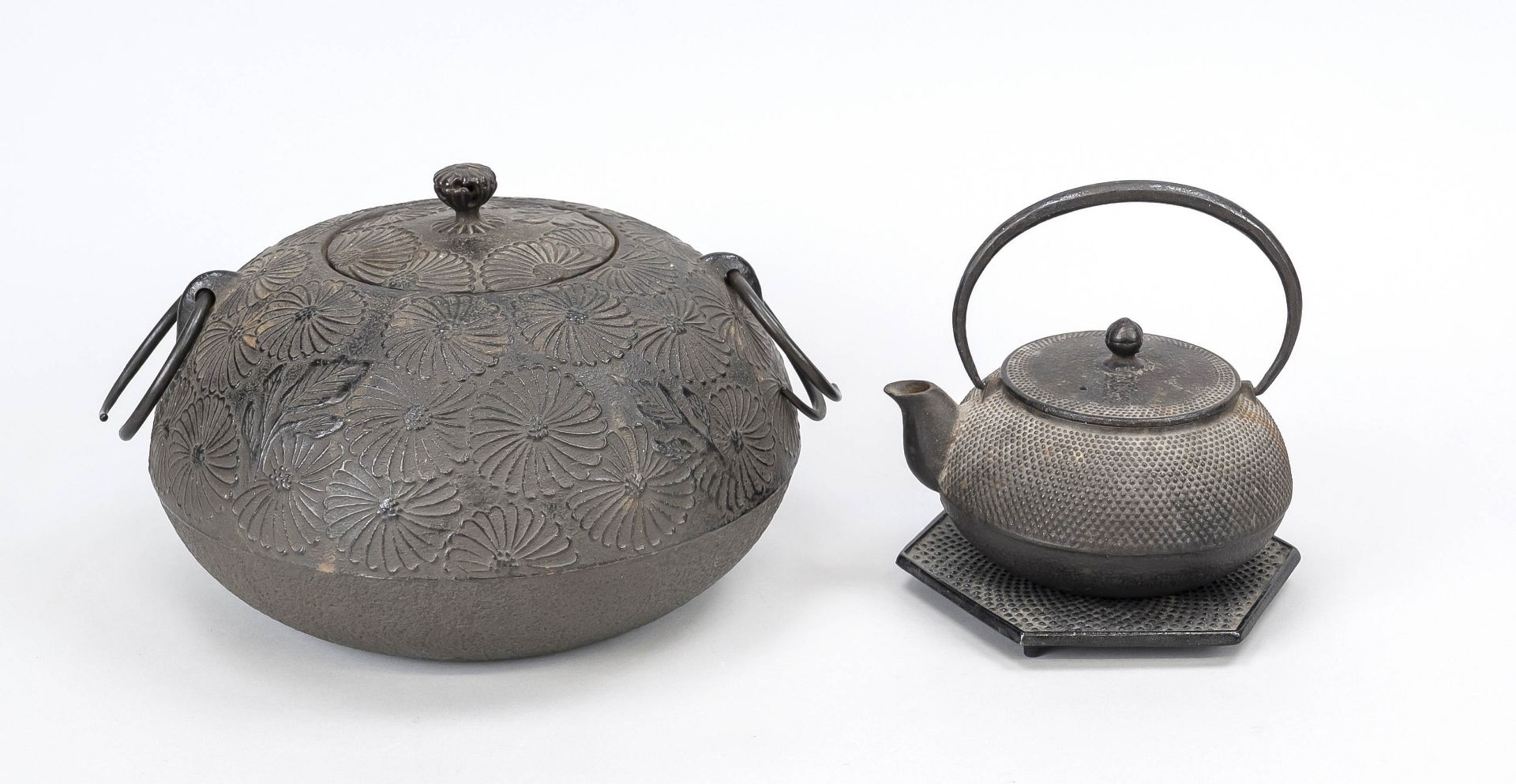 Teapot on stand and large lidded box, Japan 19th/20th century, iron. Relief decoration with