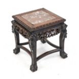 Small table, Asia, early 20th century, dark hardwood with stone inlay. Open-worked and