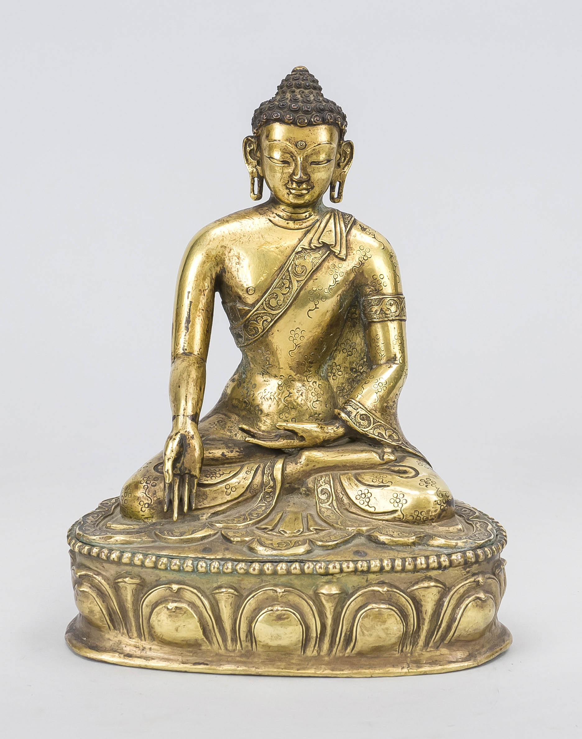 Buddha, China/Tibet probably 19th century, fire-gilt bronze. Sitting in padmasana on a lotus base,