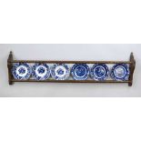 Plate board with 6 plates, Holland probably 19th century, oak board ornamentally carved, with 6 blue