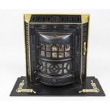 Art Nouveau stove, late 19th century, cast iron with brass decorative elements. Relief ornamented