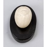 Paperweight Paperweight, probably 19th century, white and black marble. Oval plinth, on it a bird'