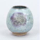 Ovoid Jun ware cup, China, exact age uncertain. Light blue to gray glaze with a purple splash,