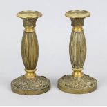 Pair of candlesticks, late 19th century, bronze/brass. Bulbous column shaft on ornamented foot, vase