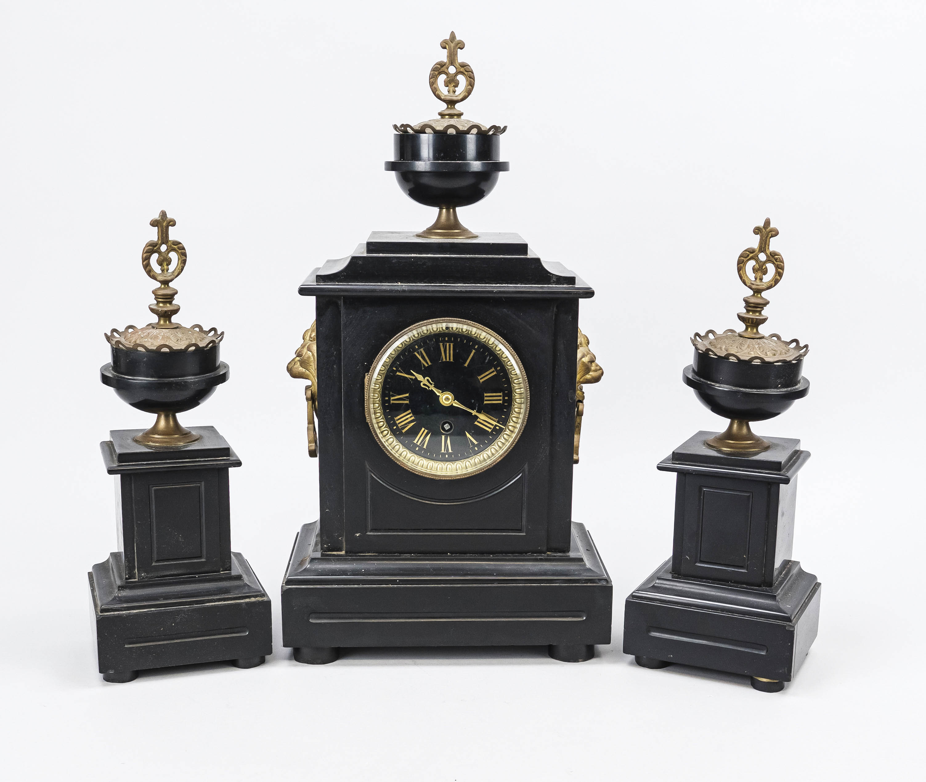 Black marble table clock with 2 side plates, 2nd half 19th century, crowned with a vase, gilded