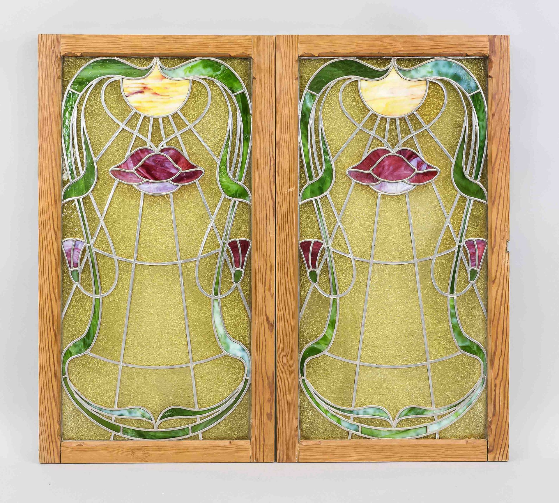 2 Art Nouveau leaded glass panels, c. 1900, symmetrically framed vegetal blossom illuminated by