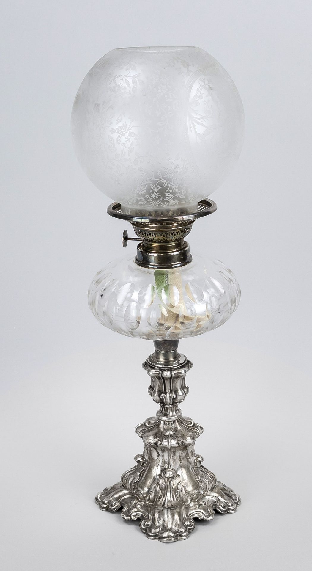 Kerosene lamp, 19th century, silver base in relief, cut glass vessel, etched spherical shade, h.