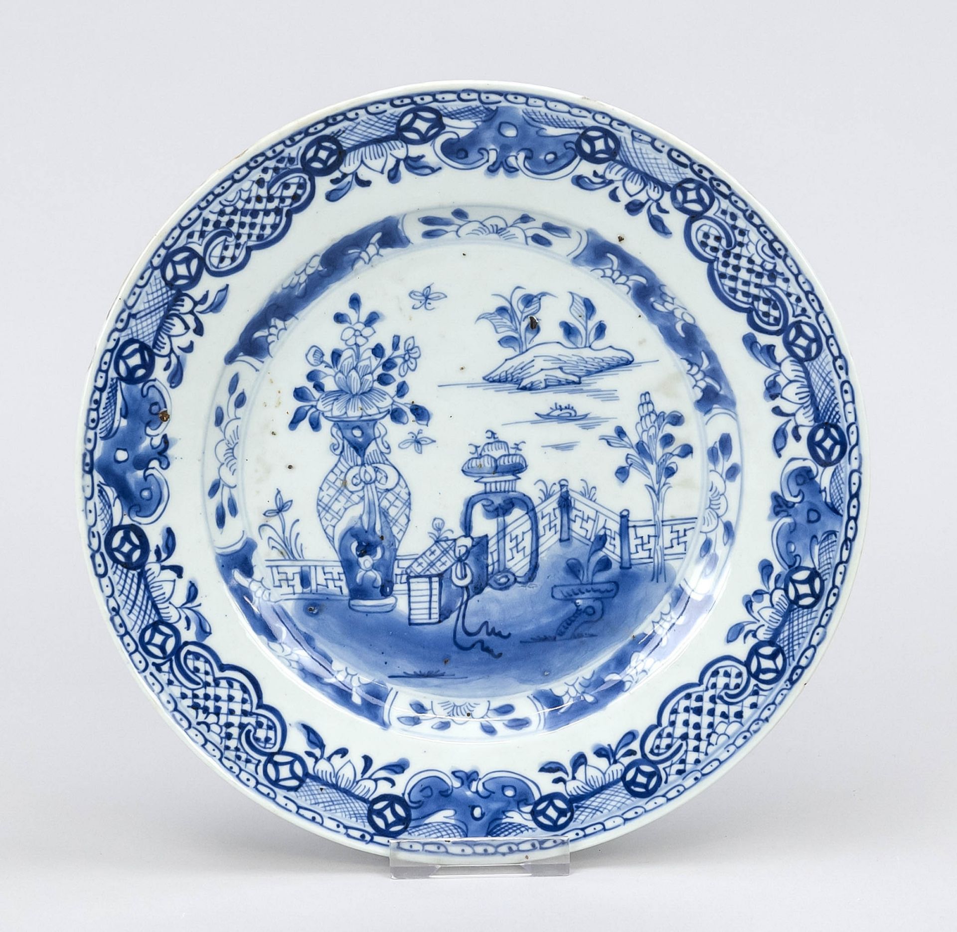 Plate with cobalt blue garden decoration, China, 17th/18th century, rim slightly chipped, d. 23.5