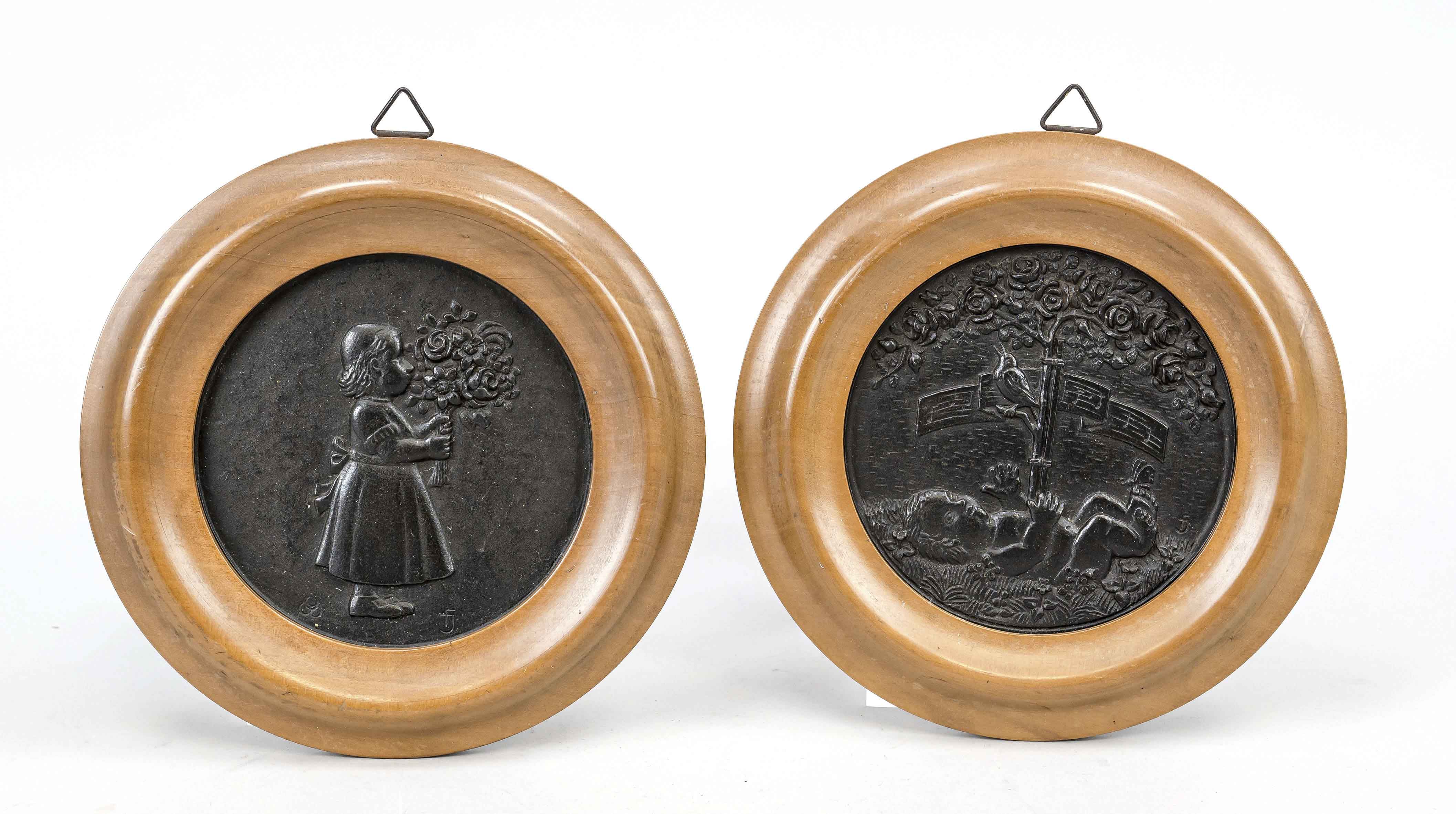 Monogrammist FJ, medalist c. 1910, two children's motifs, black patinated iron in wooden frame, each