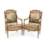 Pair of Louis Seize-style armchairs, late 19th century, carved walnut, tapered fluted legs, tapestry